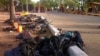 FILE - Weapons, personal items and bodies of Boko Haram fighters are seen at a roadside.