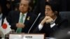 លោក Shinzo Abe នាយករដ្ឋមន្ត្រី​ជប៉ុន​នៅ​ក្នុង​កិច្ច​ប្រជុំ​កំពូល​អាស៊ាន​នៅ​ប្រទេស​ព្រុយនេ កាល​ពី​​ថ្ងៃ​ទី​១០​ខែ​តុលា ឆ្នាំ​២០១៣។