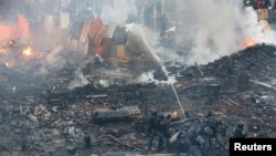 19일 우크라이나 키예프 독립광장에서 경찰이 시위대를 향해 물대포를 발사하고 있다.