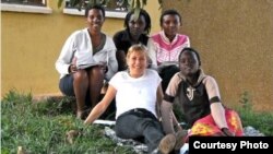 Anne Heyman with some of the youth village residents. Credit: ASYV