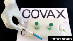 FILE PHOTO: Nurse prepares to administer the AstraZeneca/Oxford vaccine against the COVID-19 at the Eka Kotebe General Hospital in Addis Ababa