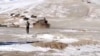 FILE - A screenshot from video shows the disengagement process between the Indian Army and China's People's Liberation Army from a contested lake area in the western Himalayas, in Ladakh region, India, Feb. 11, 2021. (Indian Army/Reuters TV/via Reuters)
