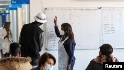 Faayilii - namoota talaallii yaalii irratti hirmaachuf eyyamamoo ta;an, Johaansburgi, Afriikaa Kibbaa