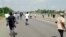 A screen grab shows people running during a protest in Abuja, Nigeria, Sept. 28, 2021. 