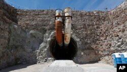 FILE - This photo shows the south portal of the proposed Yucca Mountain nuclear waste dump near Mercury, Nevada, April 9, 2015. 