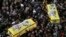 Shi'ite militant group Hezbollah's fighters and supporters carry the coffins of a father and son, wrapped in a Hezbollah flag, during their funeral procession in the southern town of Ghaziyeh, Lebanon, Jan. 21, 2015.