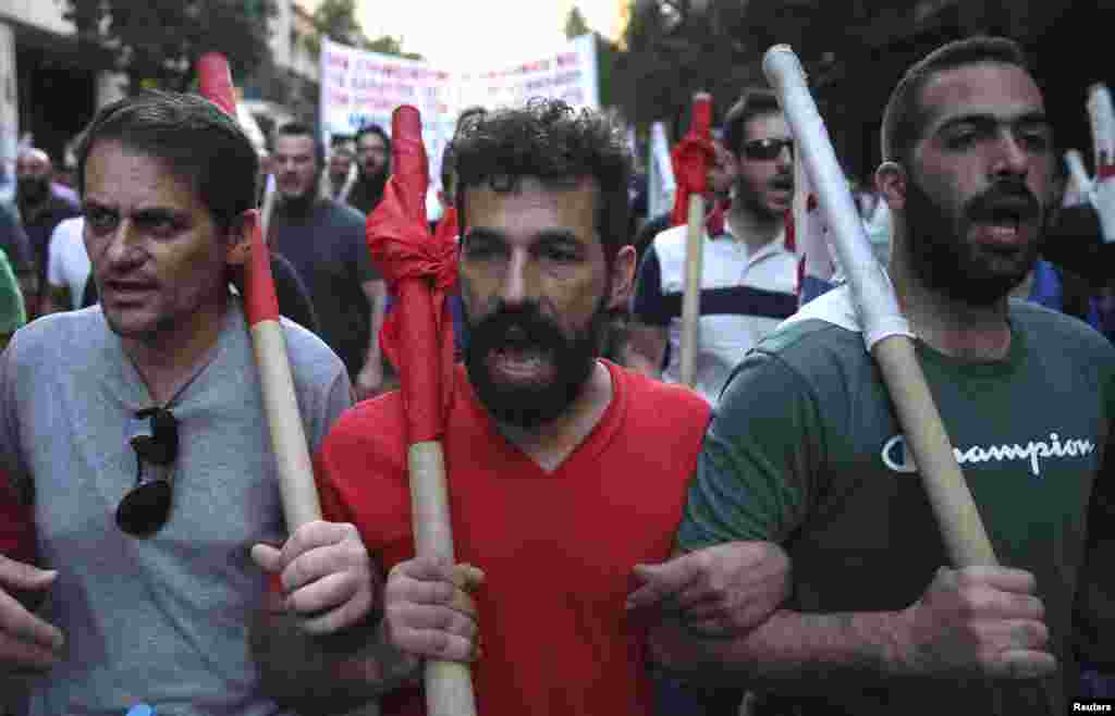 Protesters march through the streets during an anti-austerity rally in Athens, July 15, 2015.