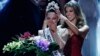 Former Miss Universe Iris Mittenaere, right, crowns new Miss Universe Demi-Leigh Nel-Peters at the Miss Universe pageant Sunday, Nov. 26, 2017, in Las Vegas. 
