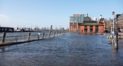 The fish market is flooded during a storm surge in Hamburg, Germany, Feb. 17, 2020.