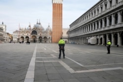 The almost empty St. Mark's Square is seen after the Italian government imposed a virtual lockdown on the north of Italy including Venice to try to contain a coronavirus outbreak, in Venice, Italy, March 9, 2020.