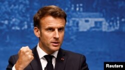 French President Emmanuel Macron addresses the media following the G7 summit