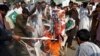 Pakistani protesters burn posters of U. S. President Donald Trump in Peshawar, Pakistan, Aug. 30, 2017. Protesters have objected to Trump's allegation that Islamabad is harboring militants who battle U.S. forces in Afghanistan.