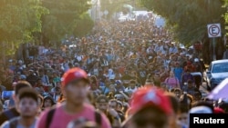 Migrants walk in a caravan during U.S. Presidential election day, in an attempt to reach Mexico's northern border, in Tapachula, Mexico Nov. 5, 2024.