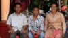 Chheum Sokhoch, middle, is pictured with his father Plung Bunkhiem, 40, and his mother, Voeun Ya, 36, at their home in Krobey Riel commune, Siem Reap, Cambodia, July 13, 2017. (Sun Narin/VOA Khmer)