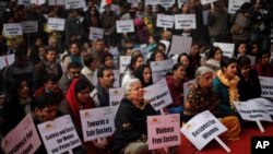 Indians sing devotional songs during a gathering to mourn the death of a 23-year old rape victim in New Delhi, India, Saturday, Jan. 5, 2013.