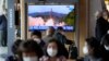 A TV screen showing a news program reporting about North Korea's missile launch with file footage is seen at a train station in Seoul, South Korea, Oct. 19, 2021.