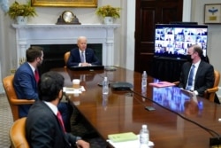 President Joe Biden participates virtually in the CEO Summit on Semiconductor and Supply Chain Resilience in the Roosevelt Room of the White House, April 12, 2021.
