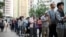 People line up to vote in district council elections in South Horizons in Hong Kong, Nov. 23, 2019.