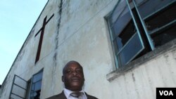Reverend Miltone Mudegu outside his church, which was attacked by Muslim youths during riots in August, Mombasa, Kenya, November 18, 2012. (H. Heuler/VOA)