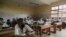 FILE - Students wearing face masks to protect against the coronavirus are seen in class at Lycee General Leclerc School in Yaounde, Cameroon, June 1, 2020.