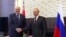 FILE - Russia's President Vladimir Putin shakes hands with his Belarusian counterpart Alexander Lukashenko during a meeting in Sochi, Russia, Sept. 14, 2020, in this still image taken from a video.