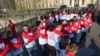 Volunteers hold hands on the Pont des Arts pedestrian bridge in central Paris to create a human chain as part of World AIDS Day, December 1, 2012.