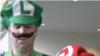 Attendees at Comic Con in San Diego dress up as the Mario brothers game characters.