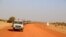 FILE - A convoy of vehicles of the Coalition of the People of Azawad (CPA) are seen patrolling an area near the Mali-Mauritania border to protect local populations from insecurity related to unrest caused by bandits, in Soumpi, Jan. 22, 2020.