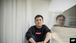 U.S. citizen Daniel Hsu poses for a portrait in the apartment he has been renting in Shanghai, China on Monday, April 13, 2020. Friends offered Hsu jobs or money to start a restaurant in Shanghai. But he always declined, worried he’d get them in…