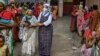 Nuns from Missionaries of Charity distribute food to the needy on the occasion of 'Peace Day' to mark the death anniversary of Mother Teresa at the Mother House in Kolkata, Sept. 5, 2021.