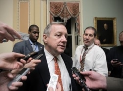 FILE - Sen. Dick Durbin, D-Ill., speaks with reporters in Washington on May 7, 2019.