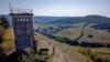 A former East German watch tower stands on a hill high above the former border area between East and West Germany in Unterweid, eastern Germany, Sept. 21, 2020.