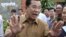 Cambodian Prime Minister Hun Sen gestures after casting his ballot in local elections at Ta Khmau town, in Kandal province.