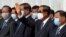 Cambodia's Prime Minister Hun Sen waves during King Norodom Sihamoni's departure to China for a health check-up at Phnom Penh International Airport in Phnom Penh on October 6, 2020. (Photo by TANG CHHIN Sothy/AFP)