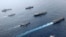 British, Canadian and Japanese vessels sail together in the Pacific Ocean on Septemebr 2021. The U.S. and its allies are becoming assertive in their approach toward a rising China. (UK Ministry of Defence via AP)