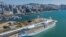 An aerial photo showing the 'Spectrum of the Seas' docked at a terminal in Hong Kong on Jan. 5, 2022, after it was ordered to return to the city for coronavirus testing after 9 people were found to be close contacts with a recent Omicron variant outbreak. 
