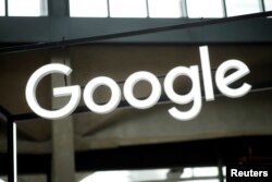 FILE - The Google logo is seen at a start-up campus in Paris, France, Feb. 15, 2018.