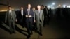 Secretary of State Rex Tillerson, right, walks on the tarmac as he arrives at Baghdad International Airport, Oct. 23, 2017, in Baghdad, Iraq.