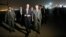 Secretary of State Rex Tillerson, right, walks on the tarmac as he arrives at Baghdad International Airport, Oct. 23, 2017, in Baghdad, Iraq.