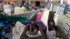 Displaced men rest in an improvised shelter at Tomping camp, where some 17,000 displaced people who fled their homes after violence erupted in South Sudan's capital Juba in mid-December are being sheltered by the United Nations, in Juba Jan. 10, 2014. 