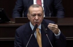 FILE - Turkey's President Recep Tayyip Erdogan addresses his ruling party lawmakers at the parliament, in Ankara, Oct. 28, 2020.