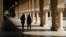 FILE- Students walk on the Stanford University campus in Santa Clara, California, March 14, 2019. 