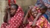 Relatives of missing school girls react in Dapchi in the northeastern state of Yobe, after an attack on the village by Boko Haram, Nigeria, Feb. 23, 2018. 