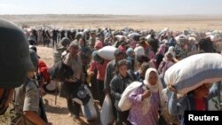 Exode de Kurdes syriens fuyant l'Etat islamique (Reuters)