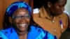 Ugandan prominent academic Stella Nyanzi smiles as she appears at Buganda Road court charged with cybercrimes after she posted profanity-filled denunciations of president Yoweri Museveni on Facebook, in Kampala, Uganda, April 25, 2017. 