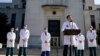 U.S. Navy Commander Dr. Sean Conley, the White House physician, is flanked by other doctors as he speaks to the media about U.S. President Donald Trump's health, at Walter Reed National Military Medical Center in Bethesda, Maryland, Oct. 4, 2020.