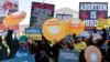 Protesters for and against abortion rights demonstrate in front of the U.S. Supreme Court, Dec. 1, 2021, in Washington.