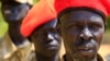 FILE - South Sudanese soldiers listen during a briefing at the army general headquarters in Juba. Government troops began withdrawing from Juba as called for in a peace agreement signed last August.