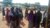 Some internally displaced women are collecting food supplies at Durumi camp, Abuja. January 1, 2020. (T. Obiezu/VOA)