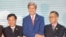 Vietnam Foreign Minister Pham Binh Minh (L), U.S. Secretary of State John Kerry (C), and an unidentified delegate from Malaysia, pose for a group photo as they shake hands during the ASEAN-U.S., on July 25, 2016.